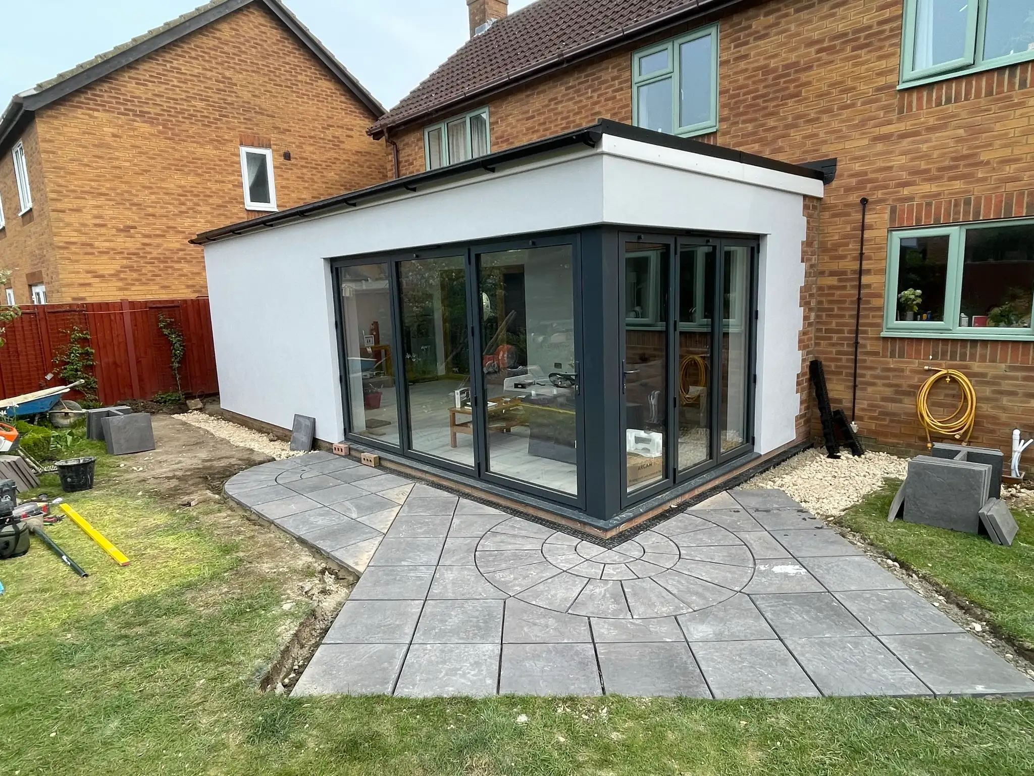 Glazed corner extension and sandstone patio